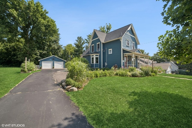 241 Hoy Ave, Woodstock, IL 60098 - view of front of home with a garage, an outbuilding, and a front yard