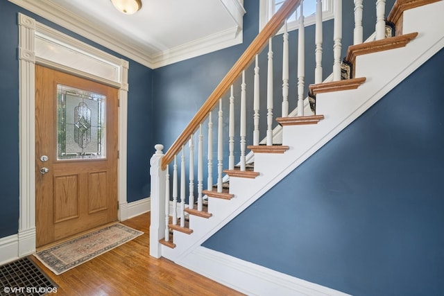 241 Hoy Ave, Woodstock, IL 60098 - entryway with wood finished floors, stairway, and crown molding