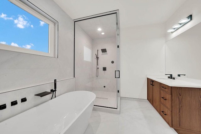 2248 W Ainslie St, Chicago, IL 60625 - full bath with a freestanding tub, a stall shower, vanity, healthy amount of natural light, and recessed lighting