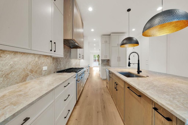 2248 W Ainslie St, Chicago, IL 60625 - kitchen featuring light wood finished floors, light stone counters, backsplash, decorative light fixtures, and recessed lighting