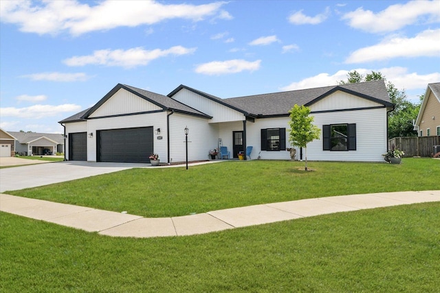 1807 E Fairfield Cir, Urbana, IL 61802 - modern farmhouse featuring a garage, driveway, and roof with shingles