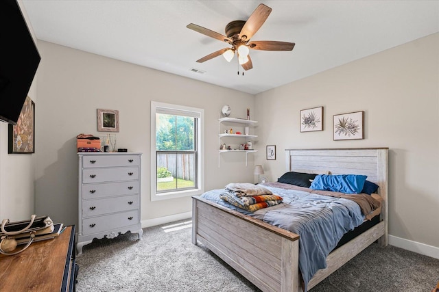 1807 E Fairfield Cir, Urbana, IL 61802 - carpeted bedroom with baseboards and a ceiling fan