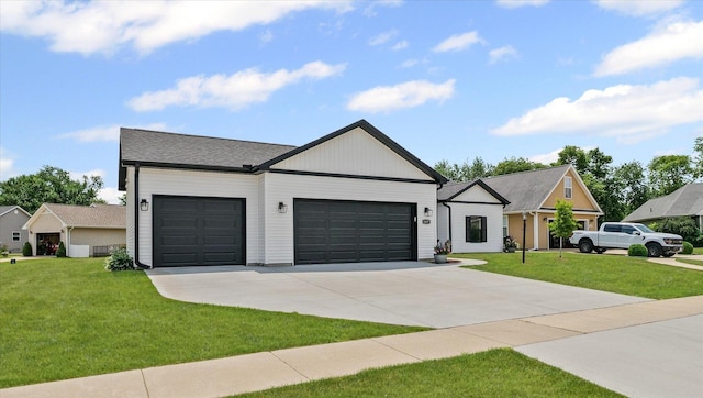 1807 E Fairfield Cir, Urbana, IL 61802 - modern farmhouse style home featuring a garage, a front lawn, and driveway
