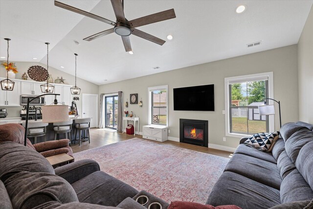 1807 E Fairfield Cir, Urbana, IL 61802 - living room with wood finished floors, a ceiling fan, healthy amount of natural light, recessed lighting, and vaulted ceiling