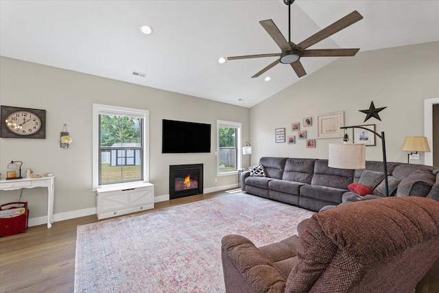 1807 E Fairfield Cir, Urbana, IL 61802 - living area with wood finished floors, a ceiling fan, lofted ceiling, recessed lighting, and a glass covered fireplace