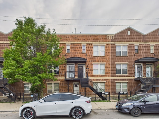 738 S Kedzie Ave Unit 3, Chicago, IL 60612 - townhome / multi-family property featuring stairs and brick siding