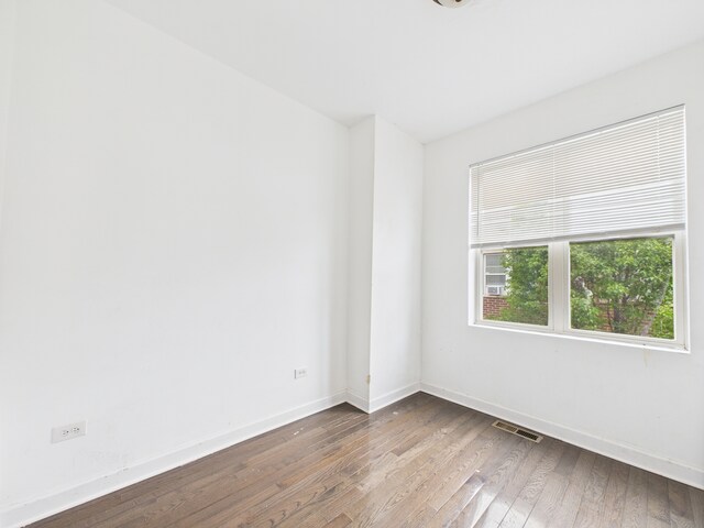 738 S Kedzie Ave Unit 3, Chicago, IL 60612 - empty room featuring wood-type flooring and baseboards