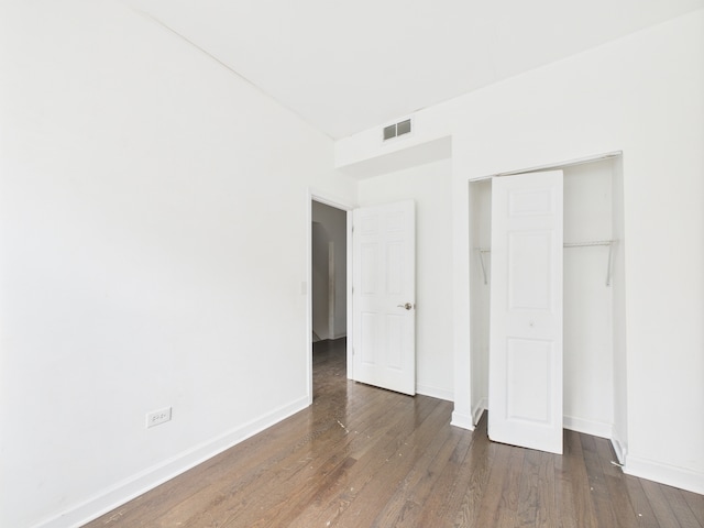 738 S Kedzie Ave Unit 3, Chicago, IL 60612 - unfurnished bedroom with wood finished floors and a closet