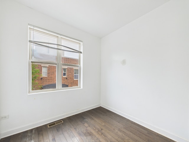 738 S Kedzie Ave Unit 3, Chicago, IL 60612 - empty room featuring dark wood-style flooring and baseboards