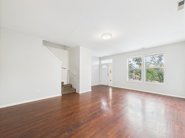 738 S Kedzie Ave Unit 3, Chicago, IL 60612 - unfurnished living room featuring stairs and wood finished floors