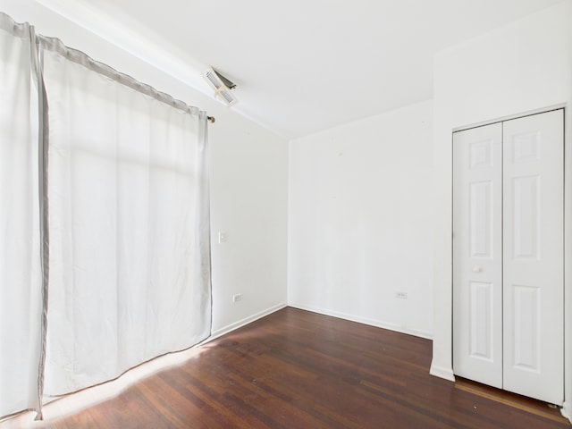 738 S Kedzie Ave Unit 3, Chicago, IL 60612 - unfurnished bedroom featuring wood finished floors and a closet