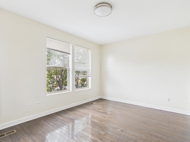 738 S Kedzie Ave Unit 3, Chicago, IL 60612 - spare room featuring dark wood-type flooring and baseboards