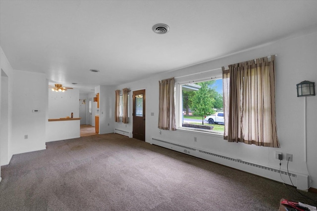 405 E Madison St, Pesotum, IL 61863 - unfurnished living room with a baseboard heating unit, a baseboard radiator, carpet, and a ceiling fan