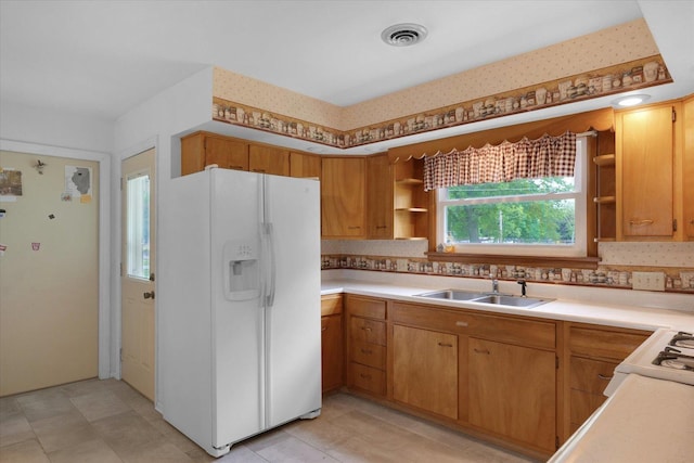 405 E Madison St, Pesotum, IL 61863 - kitchen featuring white refrigerator with ice dispenser, open shelves, light countertops, tasteful backsplash, and light tile patterned flooring