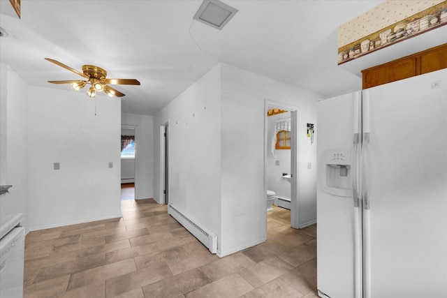 405 E Madison St, Pesotum, IL 61863 - hallway featuring a baseboard radiator