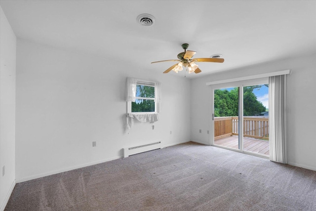 405 E Madison St, Pesotum, IL 61863 - carpeted empty room with a baseboard radiator, plenty of natural light, and a ceiling fan