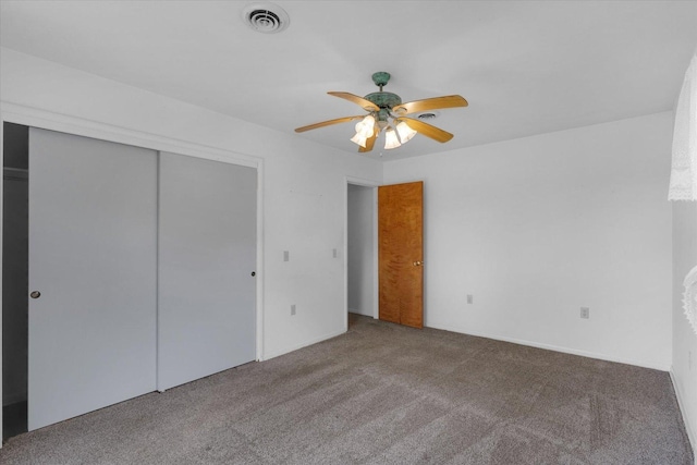 405 E Madison St, Pesotum, IL 61863 - unfurnished bedroom with carpet flooring, a closet, and a ceiling fan