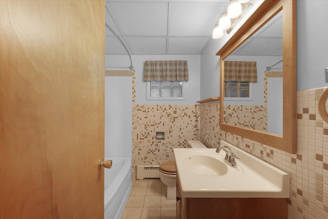 405 E Madison St, Pesotum, IL 61863 - full bath featuring tile walls, vanity, tile patterned floors, shower / bath combination, and a wainscoted wall