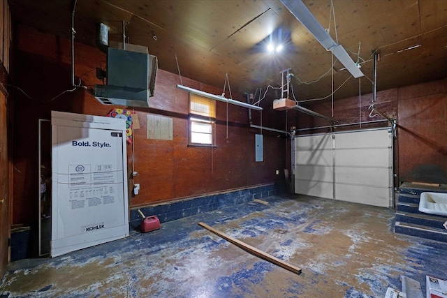 405 E Madison St, Pesotum, IL 61863 - garage featuring a garage door opener and electric panel