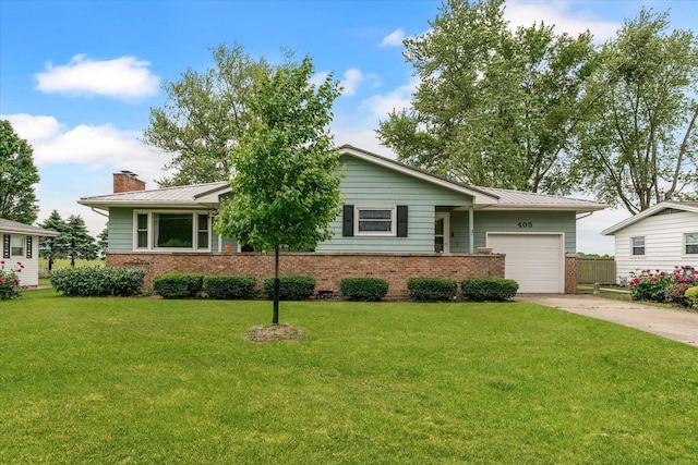 405 E Madison St, Pesotum, IL 61863 - view of front of house with brick siding, concrete driveway, a garage, and a front yard