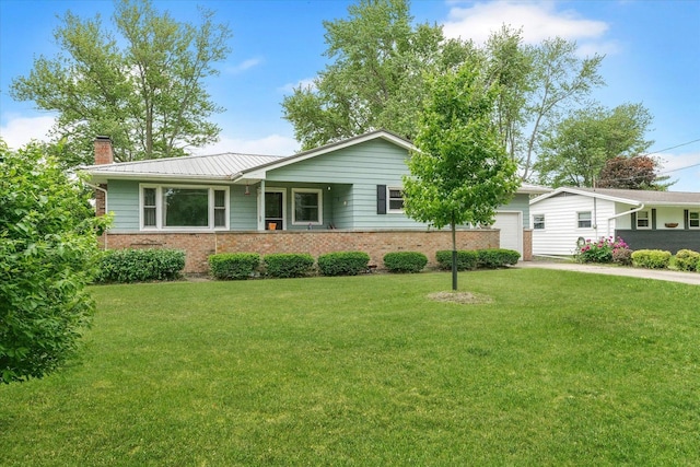 405 E Madison St, Pesotum, IL 61863 - ranch-style house with brick siding, a chimney, an attached garage, and a front lawn