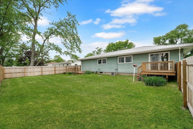 405 E Madison St, Pesotum, IL 61863 - back of property featuring a fenced backyard, a metal roof, and a wooden deck