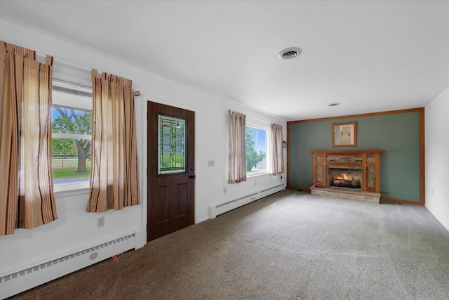 405 E Madison St, Pesotum, IL 61863 - carpeted entrance foyer with baseboard heating, a baseboard radiator, and a brick fireplace