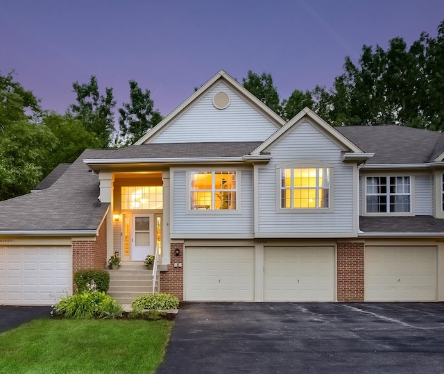 30W050 Willow Ln Unit 30W050, Warrenville, IL 60555 - bi-level home with brick siding, driveway, and a garage