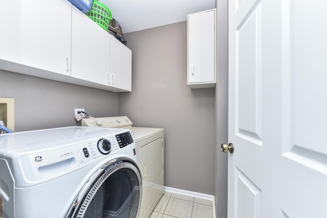 30W050 Willow Ln Unit 30W050, Warrenville, IL 60555 - laundry area featuring independent washer and dryer, cabinet space, and light tile patterned floors