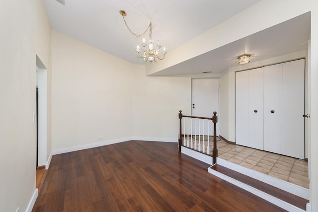 12912 Mill Dr E, Palos Park, IL 60464 - spare room featuring a chandelier and wood finished floors