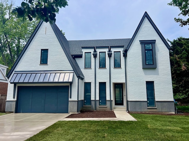 580 S Kearsage Ave, Elmhurst, IL 60126 - view of front of home with a standing seam roof, driveway, a front yard, a garage, and a shingled roof
