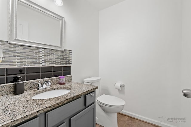 516 Madison Ln, Elgin, IL 60123 - half bath with backsplash, wood finished floors, and vanity