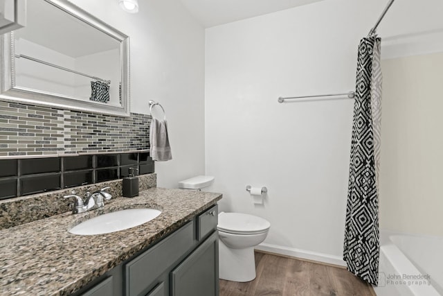 516 Madison Ln, Elgin, IL 60123 - bathroom with backsplash, vanity, wood finished floors, and shower / bath combo