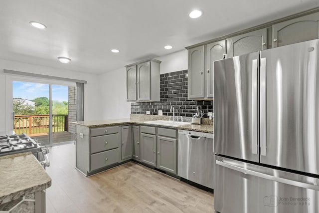 516 Madison Ln, Elgin, IL 60123 - kitchen with stainless steel appliances, gray cabinets, a peninsula, light wood-style floors, and recessed lighting