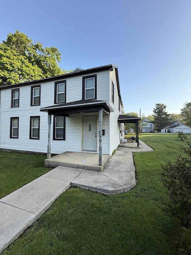 124 W Seminole St, Dwight, IL 60420 - view of front facade with a front lawn and a patio