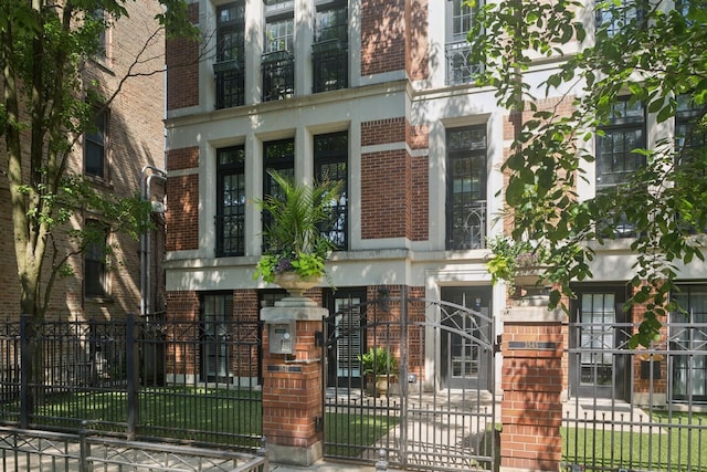 3547 N Fremont St Unit 1N, Chicago, IL 60657 - doorway to property with brick siding and a gate