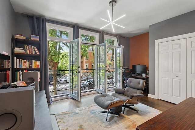 3547 N Fremont St Unit 1N, Chicago, IL 60657 - sitting room with wood finished floors, a desk, and healthy amount of natural light