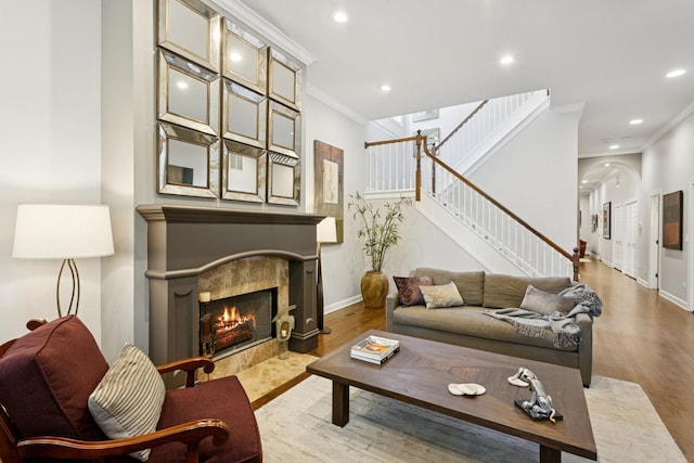 3547 N Fremont St Unit 1N, Chicago, IL 60657 - living area with crown molding, recessed lighting, wood finished floors, stairs, and a tile fireplace
