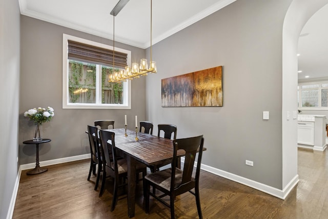 3547 N Fremont St Unit 1N, Chicago, IL 60657 - dining space featuring arched walkways, crown molding, dark wood-style flooring, healthy amount of natural light, and recessed lighting