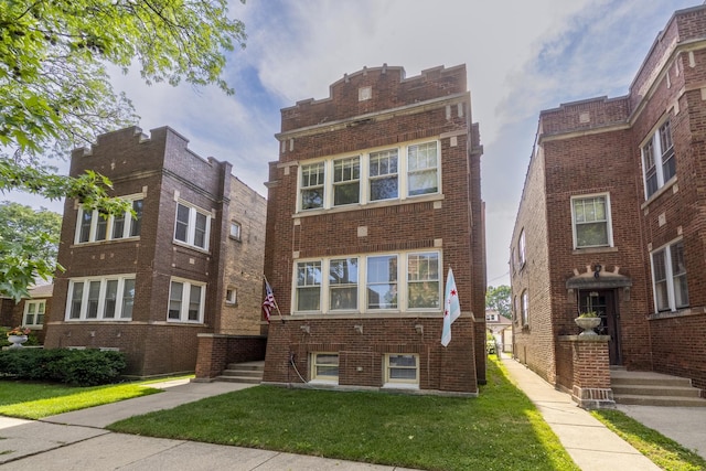 6712 N Maplewood Ave, Chicago, IL 60645 - view of front property featuring brick siding and a front yard