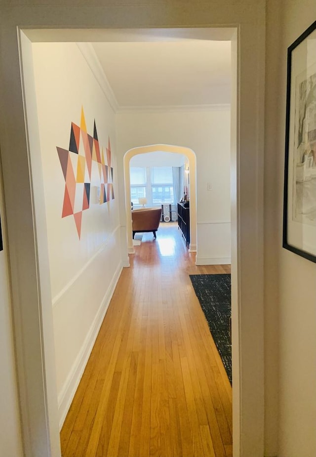 6712 N Maplewood Ave, Chicago, IL 60645 - hallway with arched walkways, crown molding, and wood finished floors