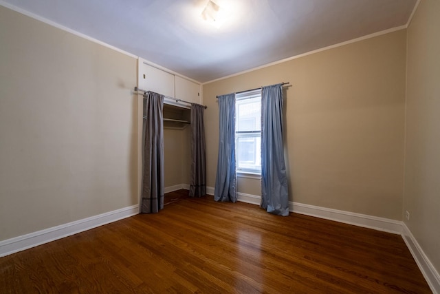 6712 N Maplewood Ave, Chicago, IL 60645 - unfurnished bedroom with dark wood-type flooring and ornamental molding