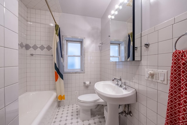 6712 N Maplewood Ave, Chicago, IL 60645 - bathroom featuring tile walls and shower / bath combo with shower curtain