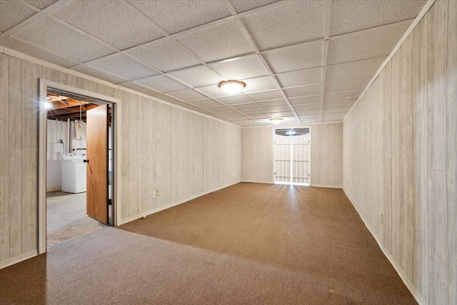 200 S Madison St, Towanda, IL 61776 - carpeted spare room featuring washer / clothes dryer, wood walls, and a drop ceiling