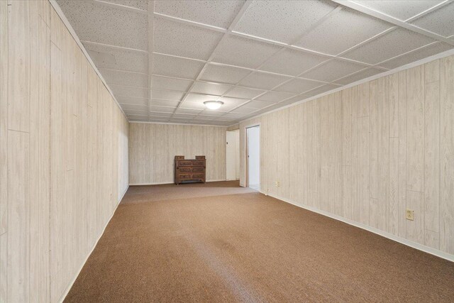 200 S Madison St, Towanda, IL 61776 - finished basement with carpet floors, wooden walls, and a drop ceiling