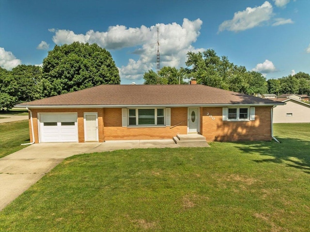 200 S Madison St, Towanda, IL 61776 - single story home featuring an attached garage, concrete driveway, brick siding, and a front lawn