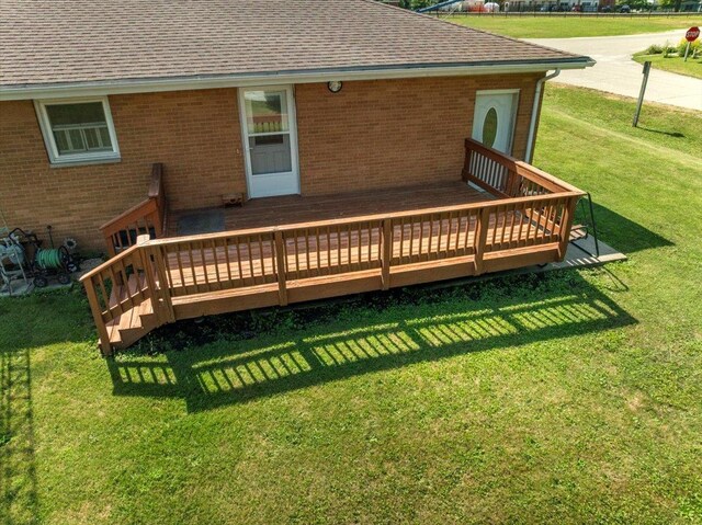 200 S Madison St, Towanda, IL 61776 - wooden deck featuring a lawn