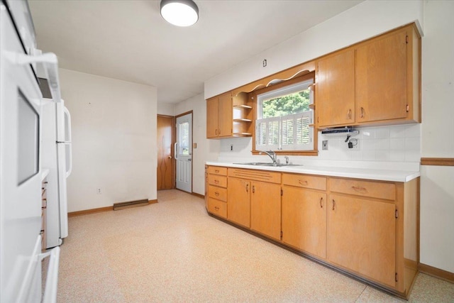 200 S Madison St, Towanda, IL 61776 - kitchen featuring light countertops, open shelves, backsplash, and light floors