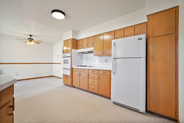 200 S Madison St, Towanda, IL 61776 - kitchen featuring white appliances, under cabinet range hood, a warming drawer, a ceiling fan, and backsplash