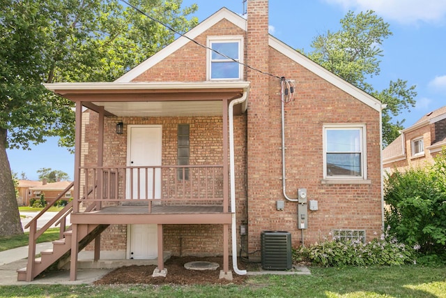 2263 S 14th Ave, North Riverside, IL 60546 - rear view of house featuring brick siding, a chimney, and stairway